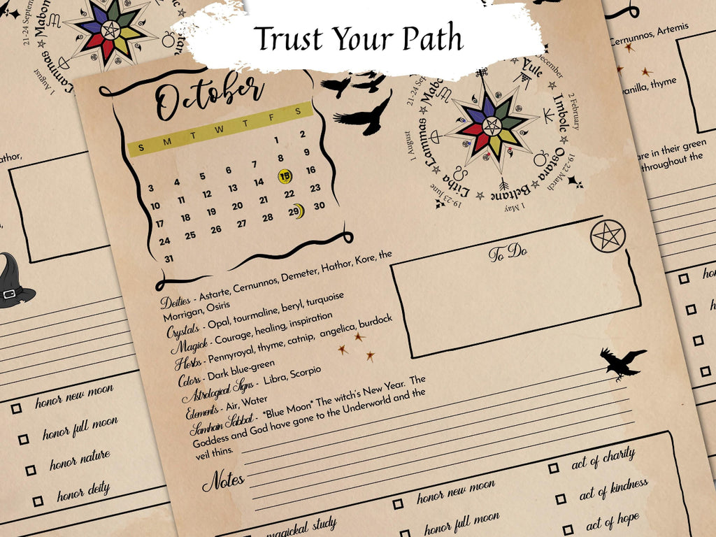 A close-up of a printed monthly calendar journal page with a beige parchment-style background, black decorative text and illustrations, a small October calendar, and a highlighted moon phase section. Another page is partially visible behind it.