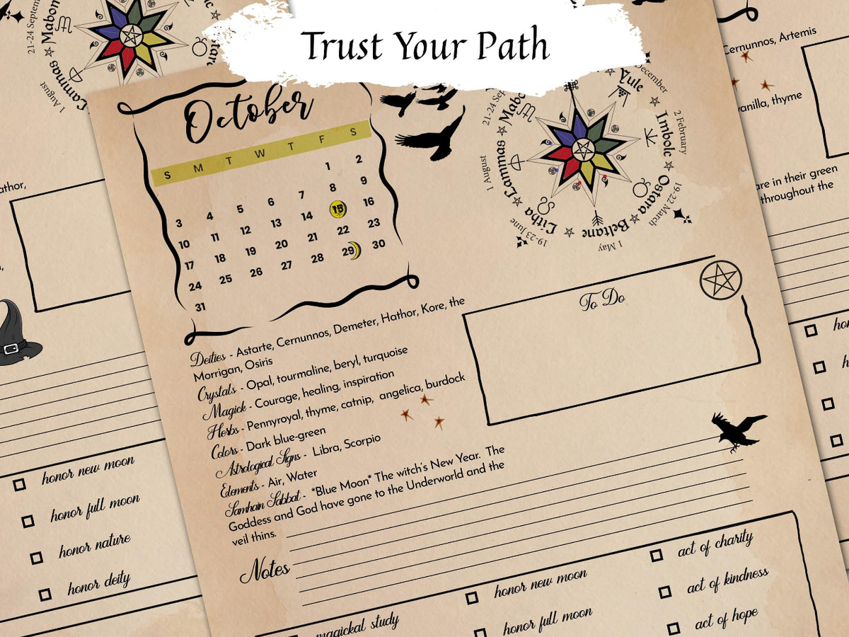 A close-up of a printed monthly calendar journal page with a beige parchment-style background, black decorative text and illustrations, a small October calendar, and a highlighted moon phase section. Another page is partially visible behind it.