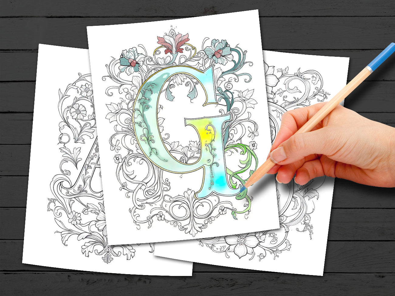 Coloring book with a decorative letter 'G' design, being colored with a pencil.