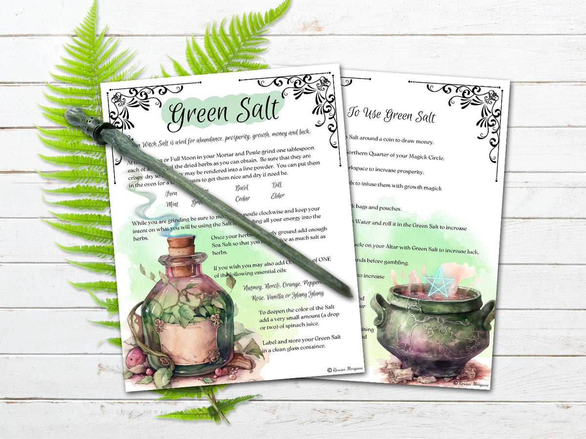 Two printed pages with green salt recipe and illustrations on a wooden surface with fern leaves.