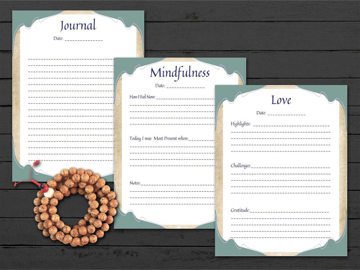 Three journal pages titled 'Journal', 'Mindfulness', and 'Love' on a wooden surface with a rosary.
