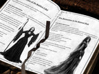Open gothic ritual book displaying an invocation to the beloved dead, with grayscale illustrations of a priestess and a veiled spirit, ornate page flourishes, and a dark ribbon bookmark draped across the pages.
