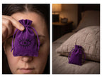 Two views of a purple charm bag: held against a woman’s forehead and placed beside a pillow.