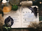 Open book with magical symbols and a potion bottle of liquid on a wooden surface