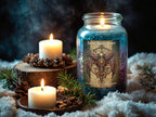 A lit glass jar candle labeled 'Solar Resurgence' stands on white faux snow beside two white pillar candles, pinecones, and evergreen branches in a dark moody setting.