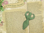 Herbal invocational text with a goddess statue on an aged paper background