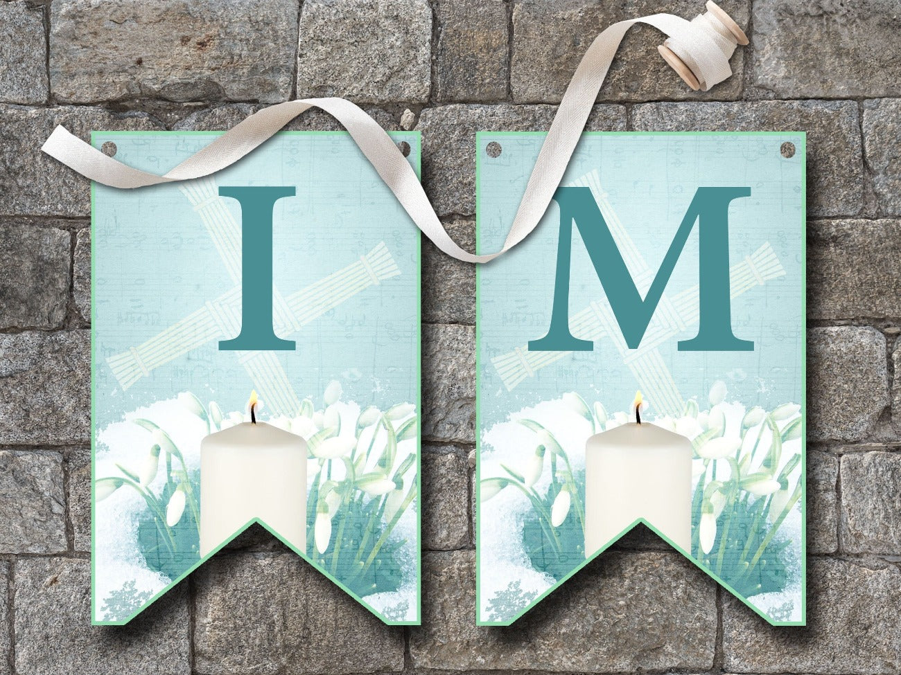 IMBOLC BANNER Bunting, Flags I and M, flags are pale blue with dark blue letters, each flag is imbellished with a Brigids Cross, snowdrops peeking through a layer of snow and a lit white candle - Morgana Magick Spell