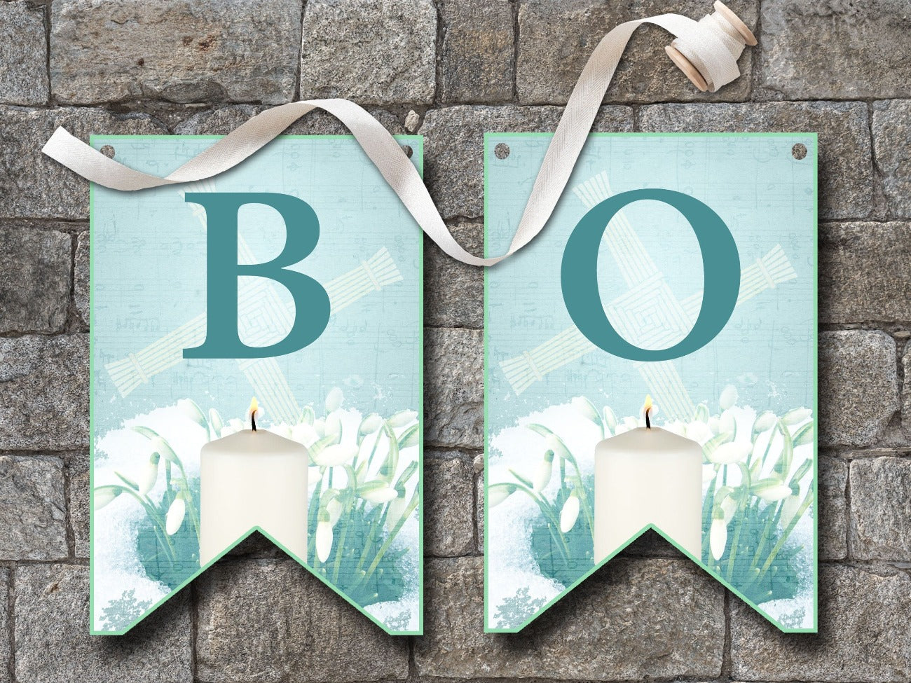 IMBOLC BANNER Bunting, Flags B and O, flags are pale blue with dark blue letters, each flag is imbellished with a Brigids Cross, snowdrops peeking through a layer of snow and a lit white candle - Morgana Magick Spell