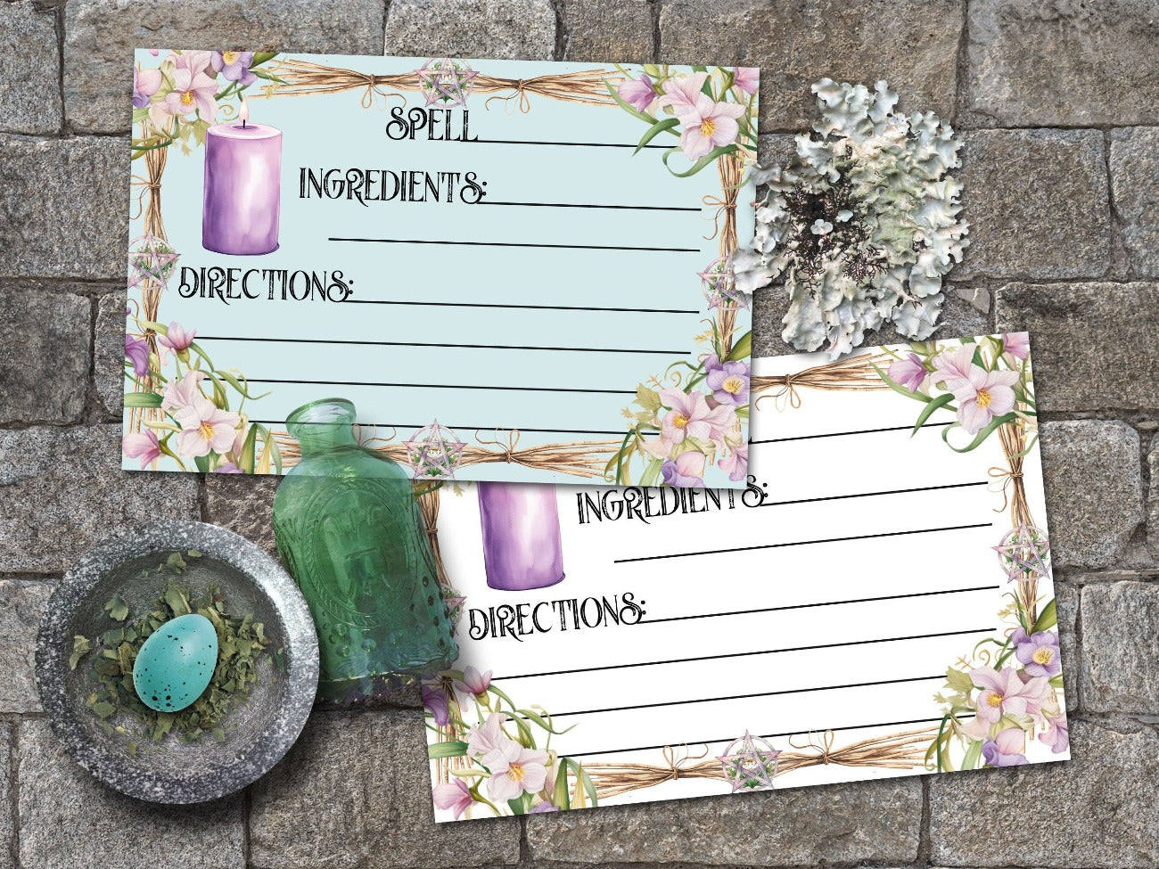 IMBOLC SPELL CARDS, Closeup of two cards, one with a pale blue background and one with a white background. Rectangular cards have whimsical font that read Spell, Ingredients, Directions - Morgana Magick Spell
