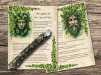 Two pages with illustrations of a green man and information about the spirit of the green man, on a wooden surface