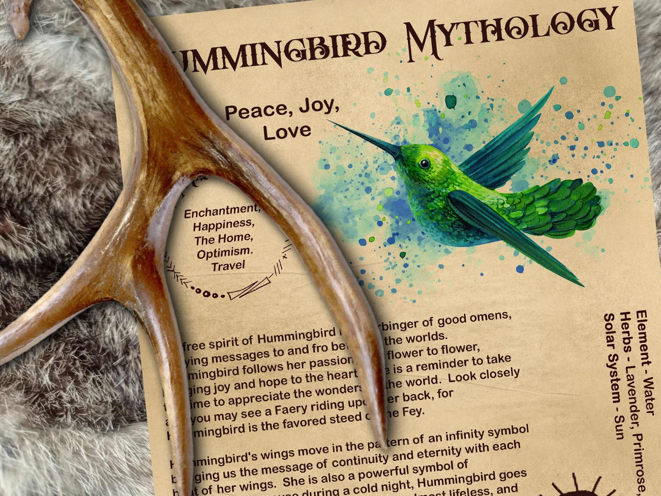 ummingbird Magick Myths & Correspondences 1 printable Book of Shadows Page is displayed in an ancient book on a fur rug with a deer antler. Shown with the parchment background
